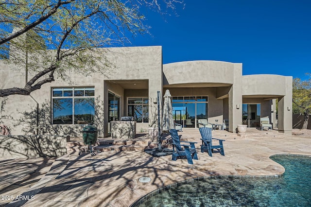 back of house featuring a patio area