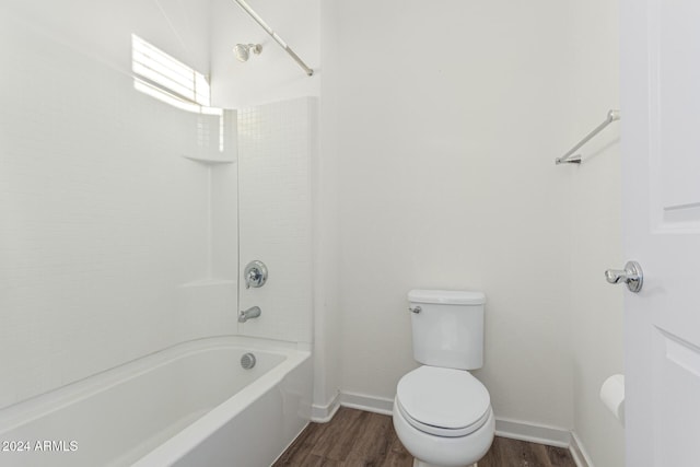 bathroom with toilet, shower / bathtub combination, and hardwood / wood-style flooring