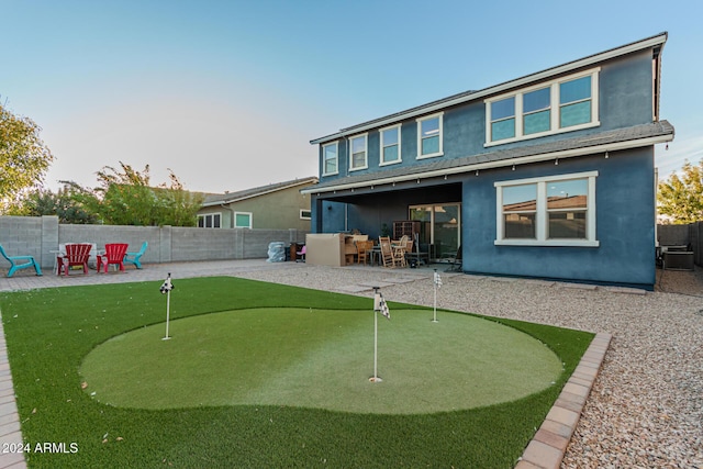 back of house with a patio area