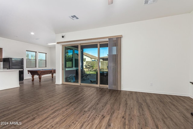 unfurnished living room featuring dark wood-type flooring and billiards