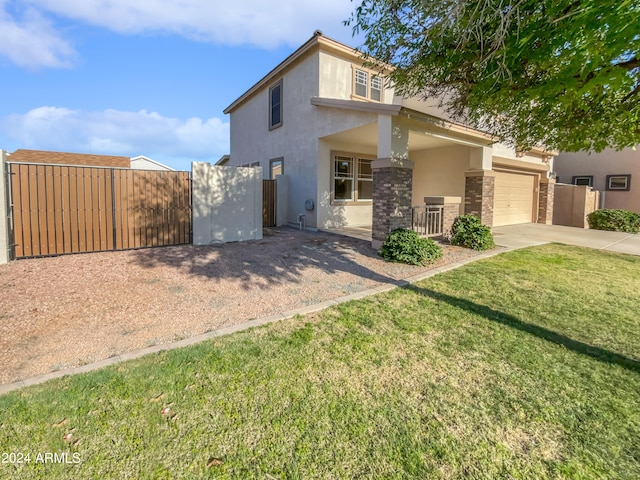 view of front facade featuring a garage and a front yard