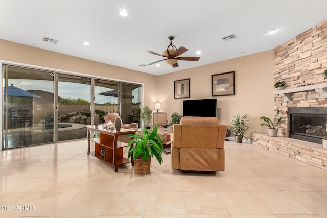 13336 W Via Caballo Blanco, Peoria, AZ 85383 - living area featuring visible vents, recessed lighting, a ceiling fan, a fireplace, and light tile patterned floors