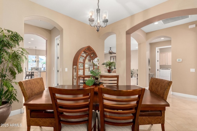 13336 W Via Caballo Blanco, Peoria, AZ 85383 - dining room with arched walkways, visible vents, a chandelier, washer / clothes dryer, and light tile patterned floors