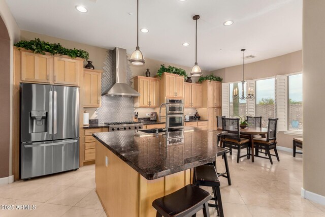 13336 W Via Caballo Blanco, Peoria, AZ 85383 - kitchen with wall chimney range hood, light brown cabinetry, baseboards, and stainless steel appliances