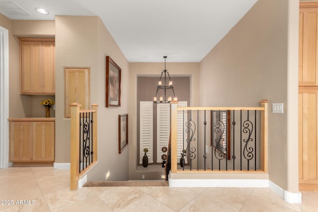 13336 W Via Caballo Blanco, Peoria, AZ 85383 - staircase with an inviting chandelier, tile patterned flooring, and baseboards
