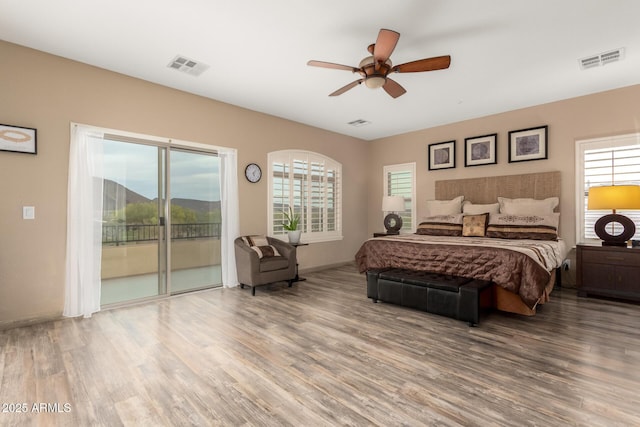 13336 W Via Caballo Blanco, Peoria, AZ 85383 - bedroom with wood finished floors, visible vents, access to outside, and a ceiling fan