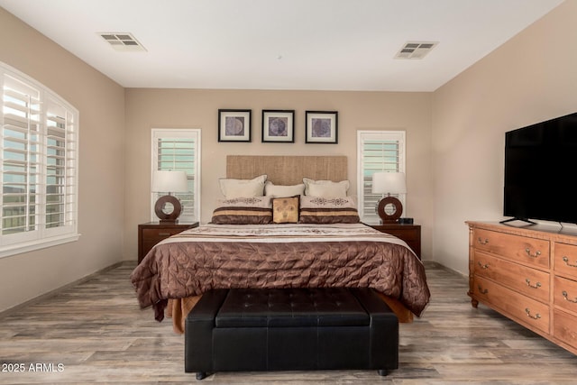 13336 W Via Caballo Blanco, Peoria, AZ 85383 - bedroom featuring multiple windows, wood finished floors, and visible vents