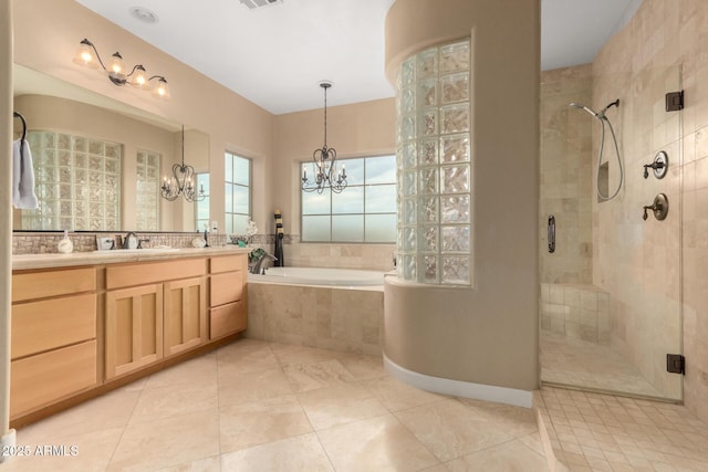 13336 W Via Caballo Blanco, Peoria, AZ 85383 - full bathroom with a shower stall, a garden tub, vanity, and an inviting chandelier