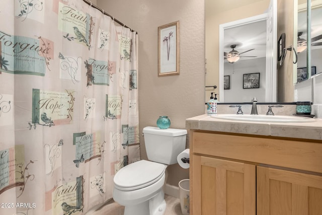 13336 W Via Caballo Blanco, Peoria, AZ 85383 - bathroom featuring ceiling fan, toilet, vanity, and curtained shower