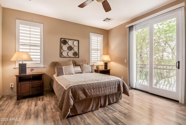 13336 W Via Caballo Blanco, Peoria, AZ 85383 - bedroom with wood finished floors, access to outside, and multiple windows
