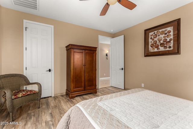 13336 W Via Caballo Blanco, Peoria, AZ 85383 - bedroom with light wood finished floors, baseboards, visible vents, and ceiling fan