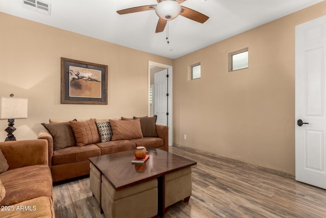 13336 W Via Caballo Blanco, Peoria, AZ 85383 - living room featuring wood finished floors, a ceiling fan, and visible vents