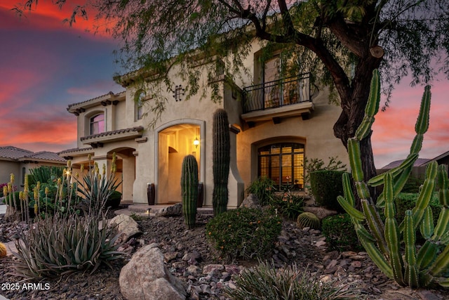 13336 W Via Caballo Blanco, Peoria, AZ 85383 - mediterranean / spanish-style house with stucco siding, a tile roof, and a balcony