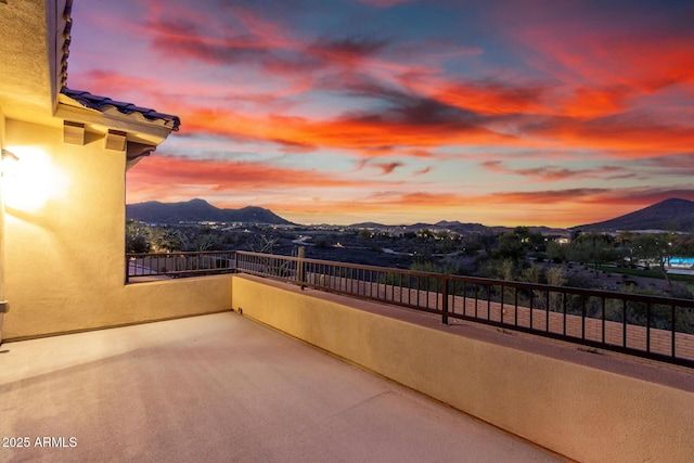 13336 W Via Caballo Blanco, Peoria, AZ 85383 - patio terrace at dusk featuring a balcony and a mountain view