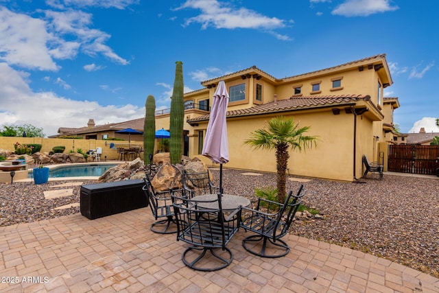 13336 W Via Caballo Blanco, Peoria, AZ 85383 - view of patio featuring a fenced backyard, a fenced in pool, and outdoor dining space