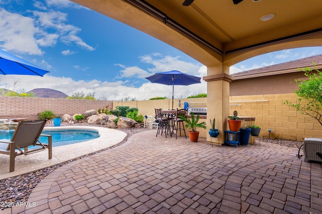 13336 W Via Caballo Blanco, Peoria, AZ 85383 - view of patio featuring a fenced backyard, a ceiling fan, and a fenced in pool