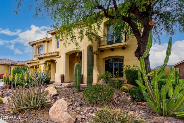 13336 W Via Caballo Blanco, Peoria, AZ 85383 - mediterranean / spanish-style house featuring a tile roof, a balcony, and stucco siding