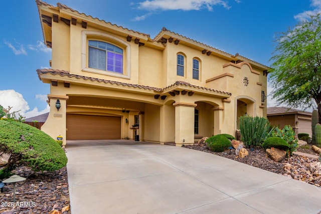 13336 W Via Caballo Blanco, Peoria, AZ 85383 - mediterranean / spanish home featuring an attached garage, a tiled roof, and stucco siding