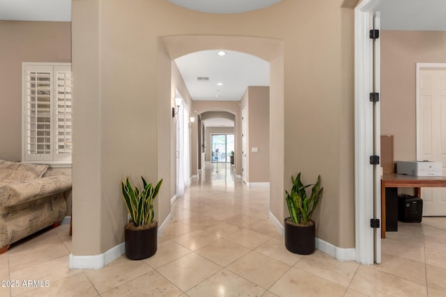 13336 W Via Caballo Blanco, Peoria, AZ 85383 - corridor featuring recessed lighting, baseboards, arched walkways, and light tile patterned floors