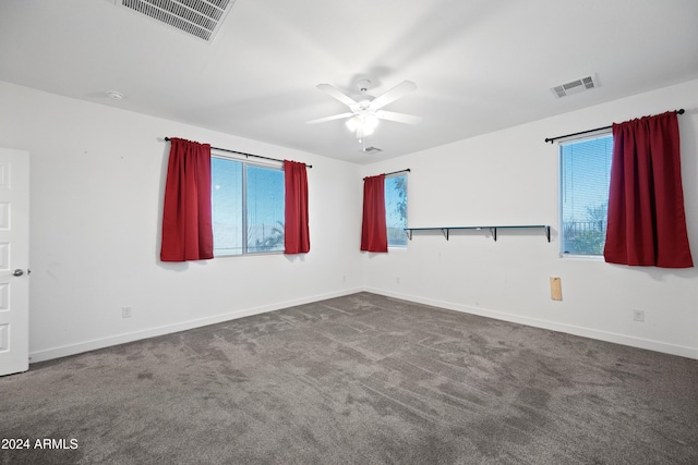 unfurnished room featuring ceiling fan and carpet