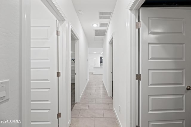 hallway with light tile patterned floors