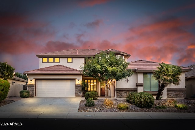 mediterranean / spanish-style house with a garage