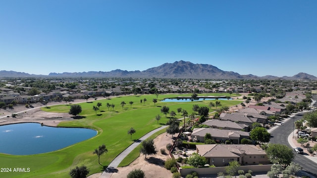 birds eye view of property with a water and mountain view