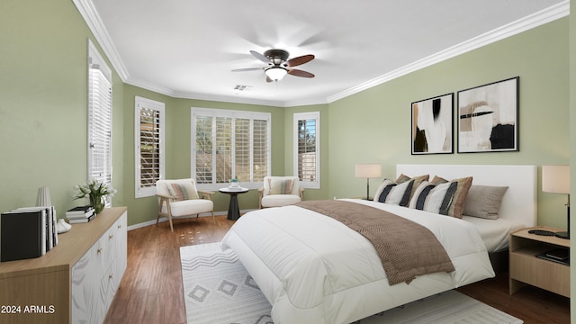 bedroom featuring ornamental molding, dark hardwood / wood-style flooring, and ceiling fan