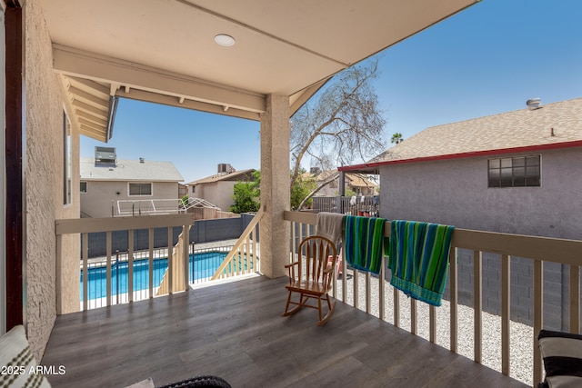 wooden terrace featuring fence