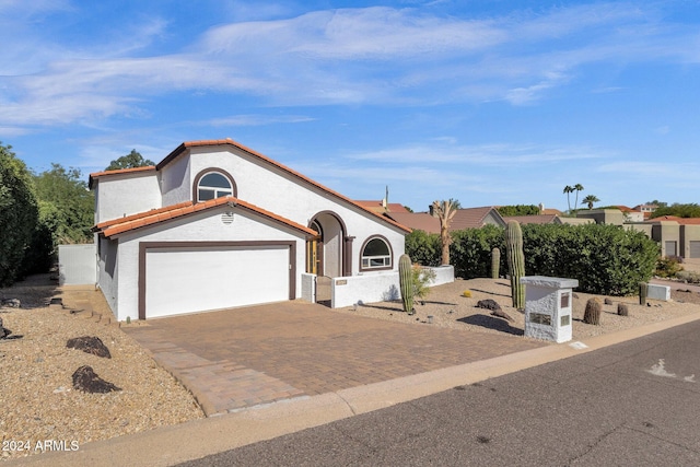 view of front of property with a garage