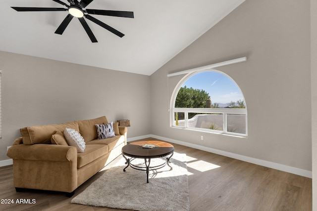 living room featuring ceiling fan, hardwood / wood-style flooring, and high vaulted ceiling