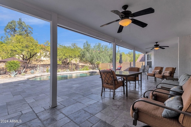 exterior space with ceiling fan, a fenced in pool, and an outdoor hangout area