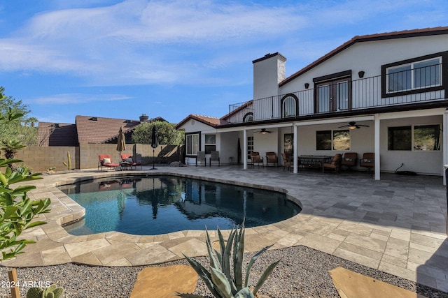 view of pool with a patio and ceiling fan