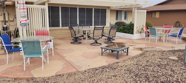 view of patio with a pergola and an outdoor fire pit