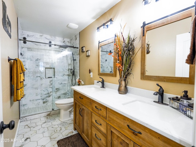 full bathroom with toilet, a sink, a marble finish shower, and double vanity