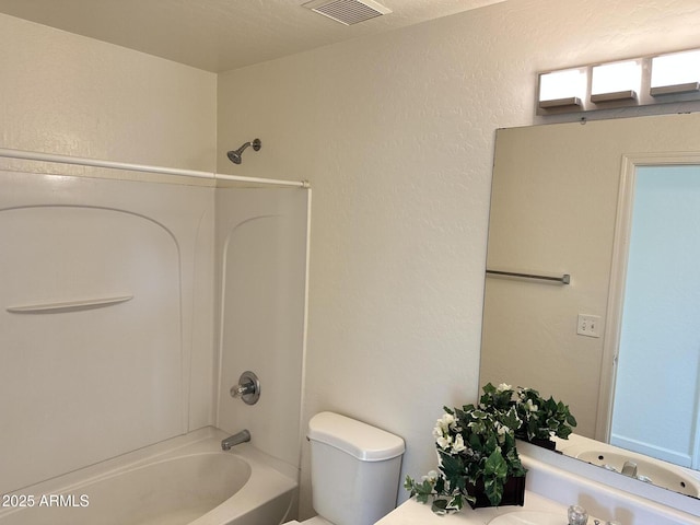 full bathroom with sink, shower / bathing tub combination, and toilet