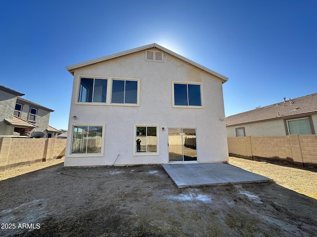 back of house featuring a patio area