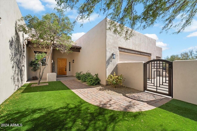 exterior space with a lawn and a garage