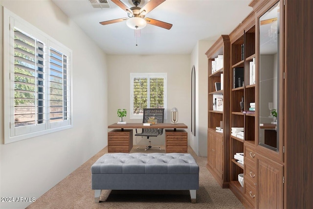 home office featuring carpet and ceiling fan