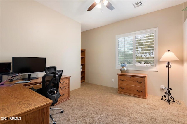 office with light carpet and ceiling fan