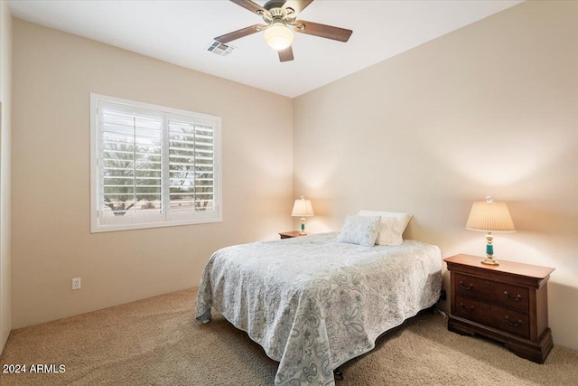 bedroom featuring light colored carpet and ceiling fan