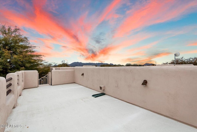 view of patio terrace at dusk