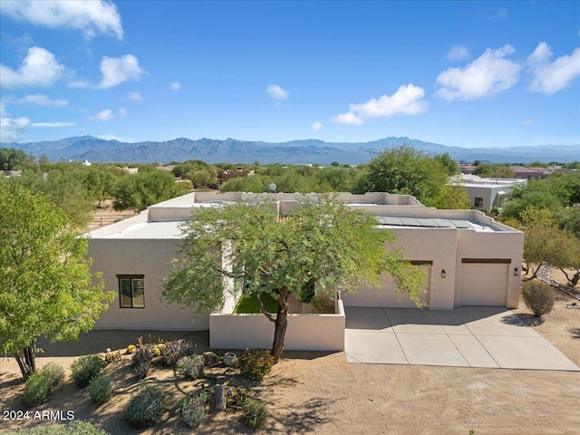 drone / aerial view featuring a mountain view