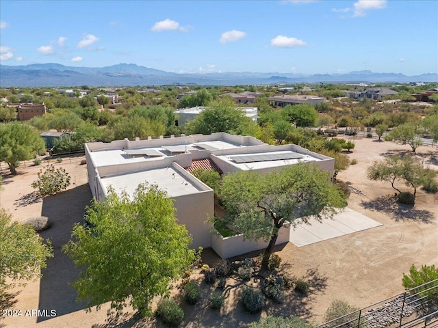 birds eye view of property with a mountain view