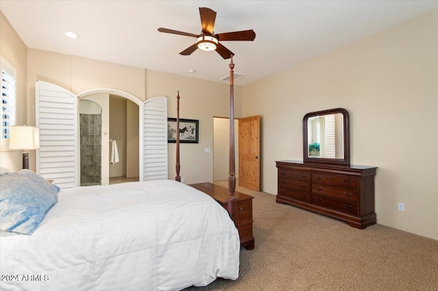 bedroom featuring light colored carpet and ceiling fan