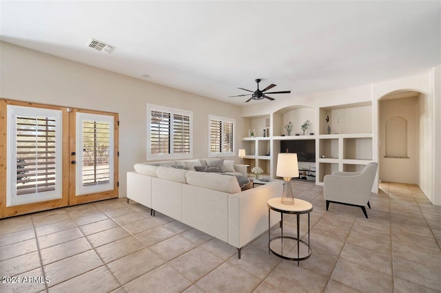 living room with french doors and ceiling fan