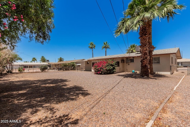 rear view of property with fence