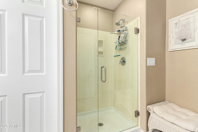bathroom with a shower stall