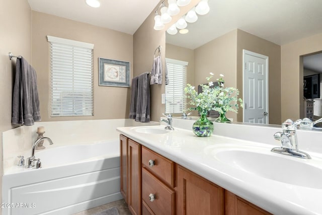 full bathroom featuring a bath, a sink, and double vanity