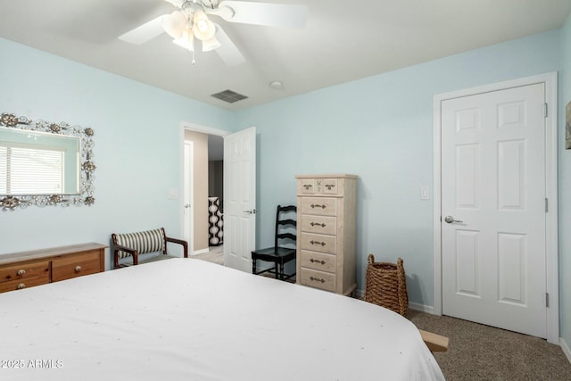 carpeted bedroom featuring ceiling fan, baseboards, and visible vents